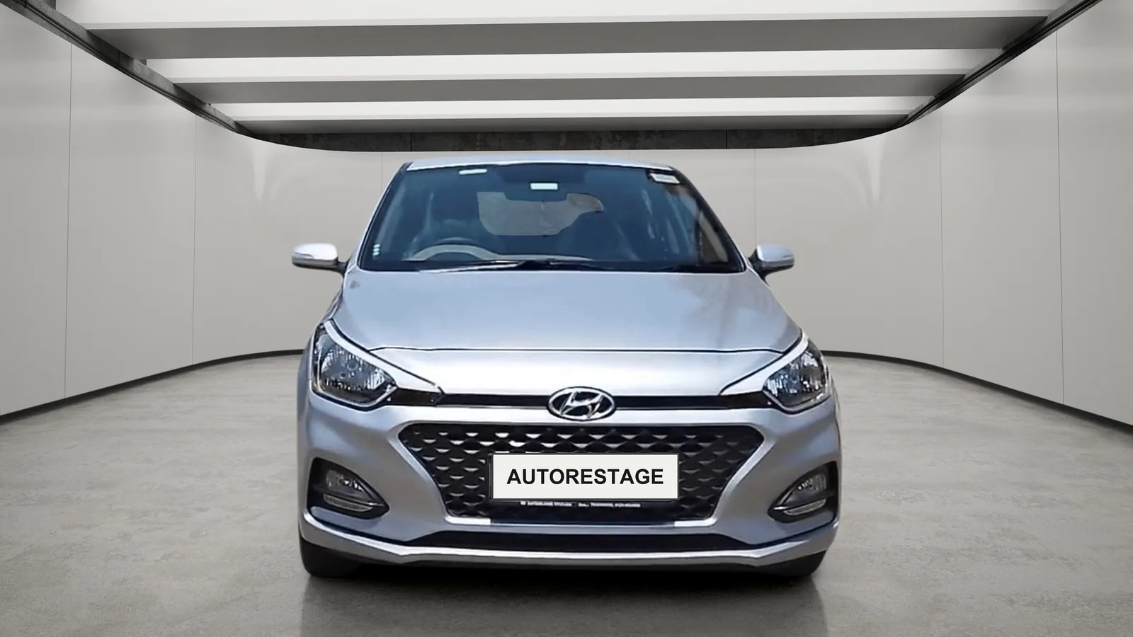 The same car on a lit studio floor with a reflected ceiling and a soft shadow.