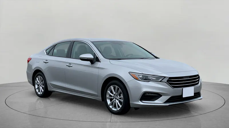 The same sedan on a grey sweep.