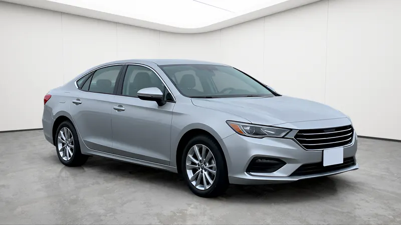 The same sedan in a white cove.
